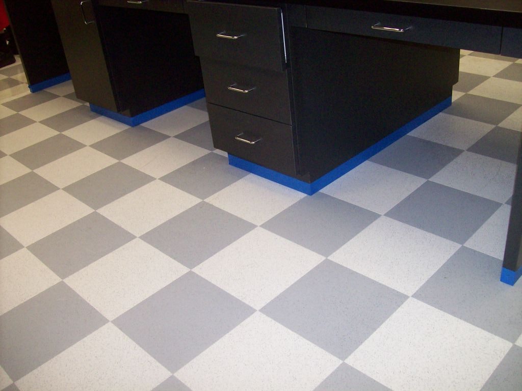 Completed commercial cabinet and checkerboard flooring installation