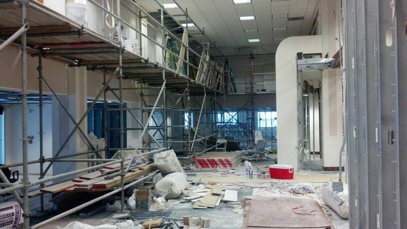 Commercial interior renovation with scaffolding in progress